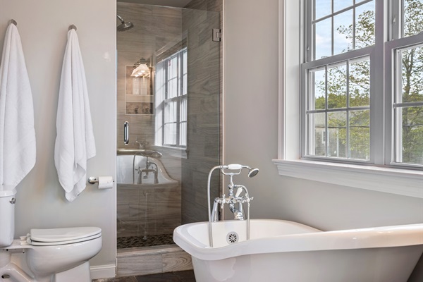 Relax and rejuvenate in your ensuite bathroom, where a beautiful bathtub  and shower invites you to unwind!