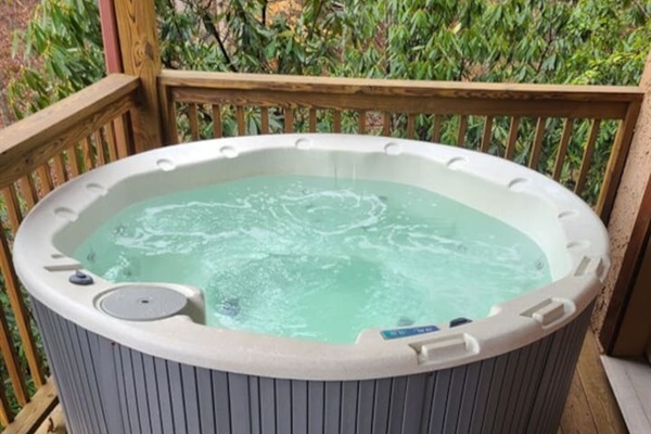 Hot tub located on lower level of cabin
