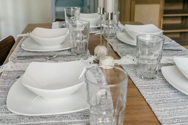 Dining room seats 6 at the table and 3 at the hightop bar table. This is the view towards the main floor bathroom and laundry room. 