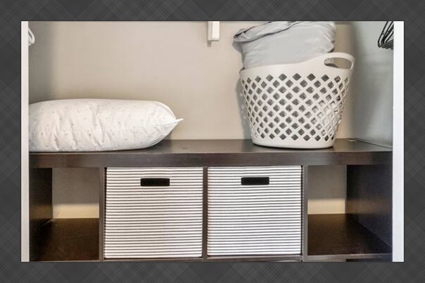 This oversized closet offers hanging space, extra linens, a laundry basket, and smart storage cubes—ideal for extended stays or traveling families.