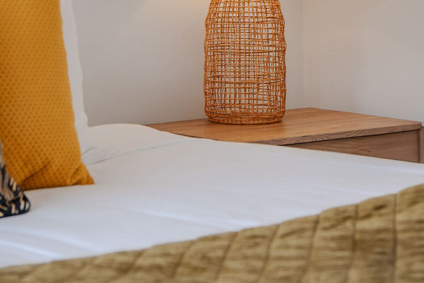 Fernhill Mountain Escape’s upstairs bedroom adds a flexible Queenstown sleeping space, with king singles, balcony access and mountain views from Fernhill.