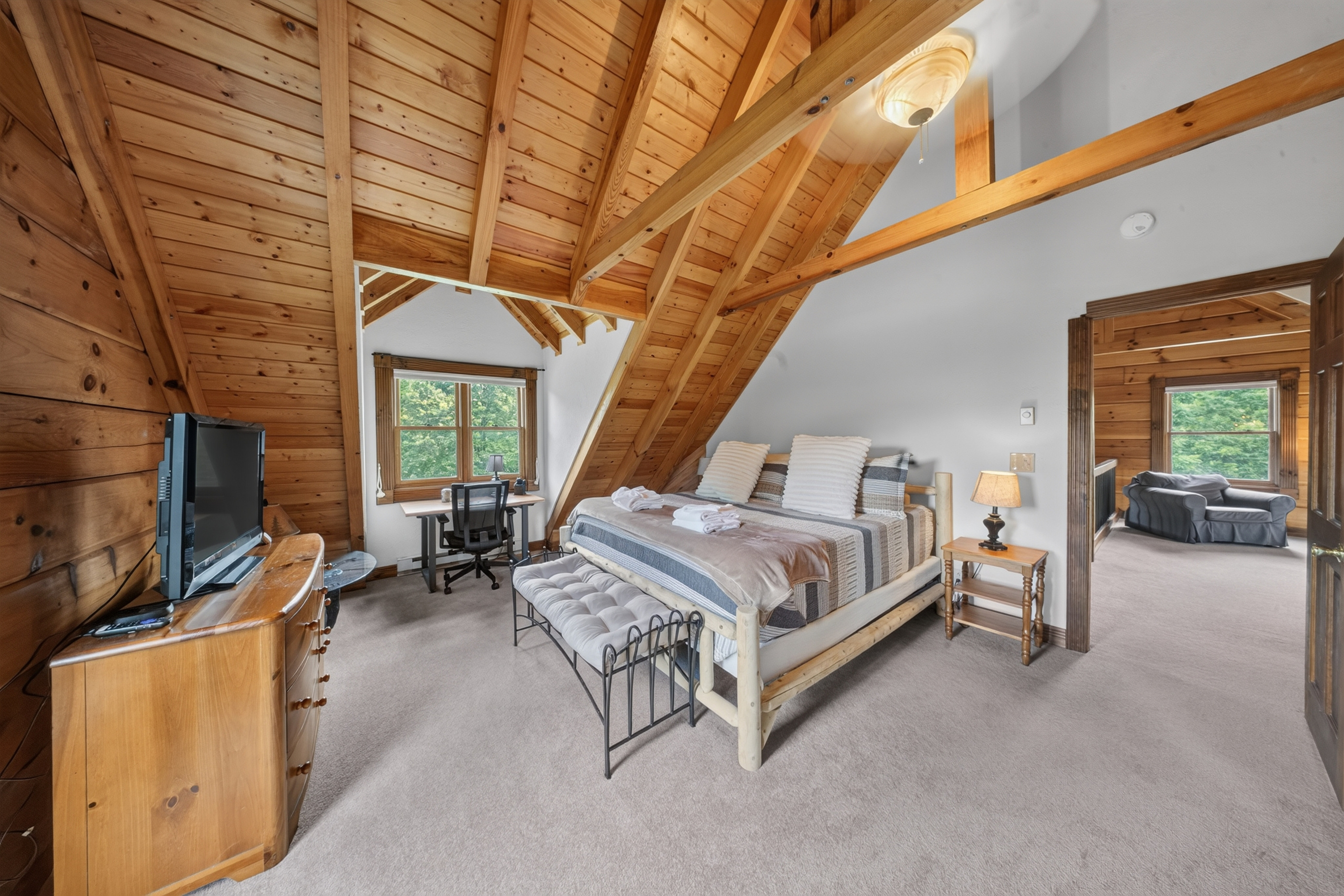Primary bedroom, King sized memory foam mattress, black out shades, and patio door leading to private balcony.