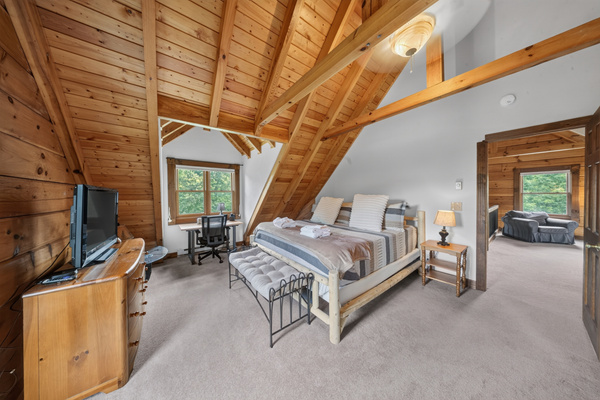 Primary bedroom, King sized memory foam mattress, black out shades, and patio door leading to private balcony.