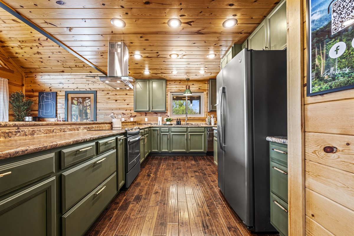 Cook, gather, and create memories in the spacious kitchen at Signature Stay, designed for both convenience and comfort in the heart of the Smoky Mountains