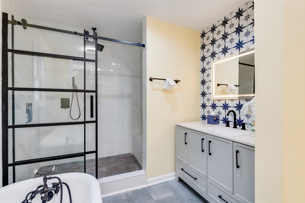 Upstairs Ensuite Full Bathroom 2: Enjoy stylish decor and modern amenities for a refreshing experience!