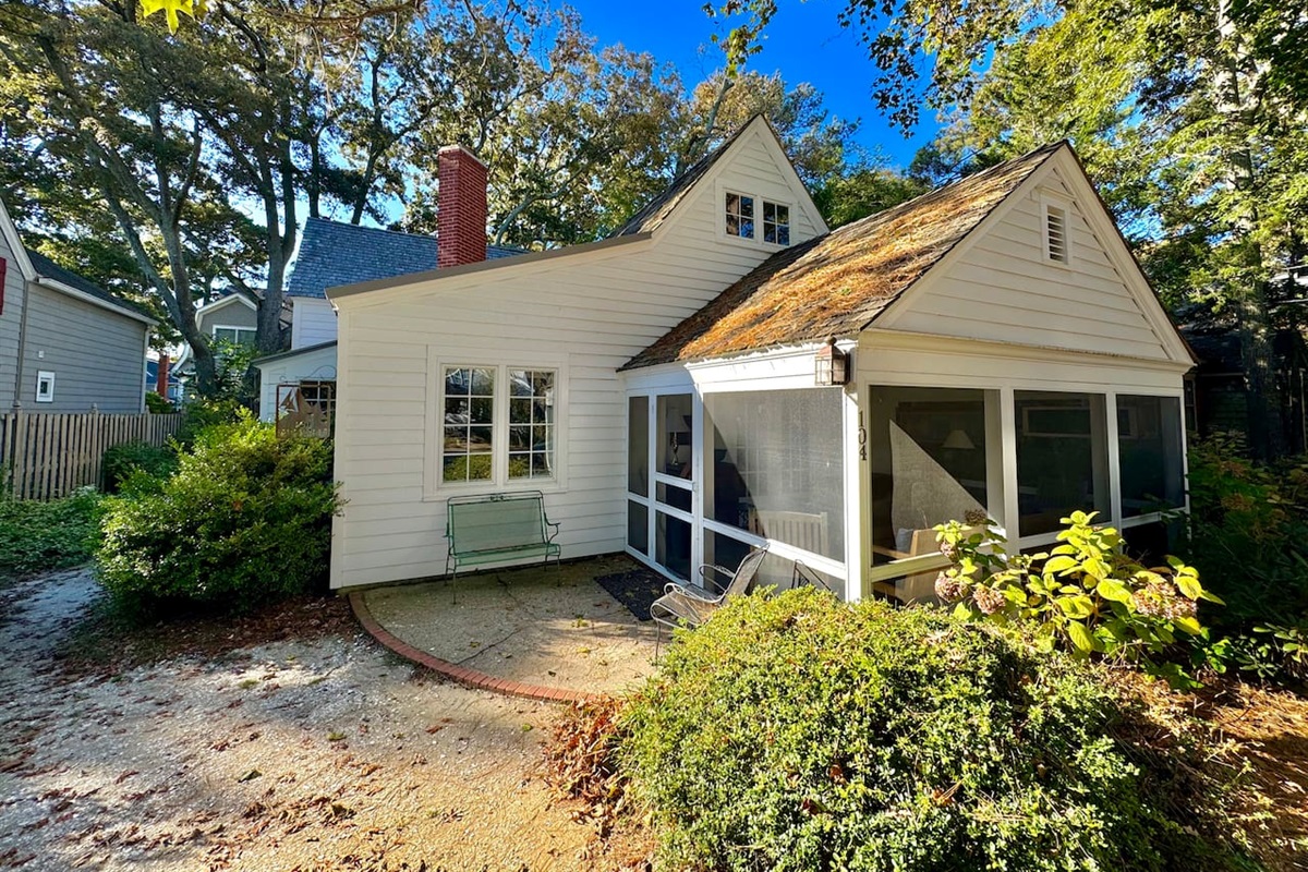 Front of the house, cozy screened in porch on a wooded quite lot 