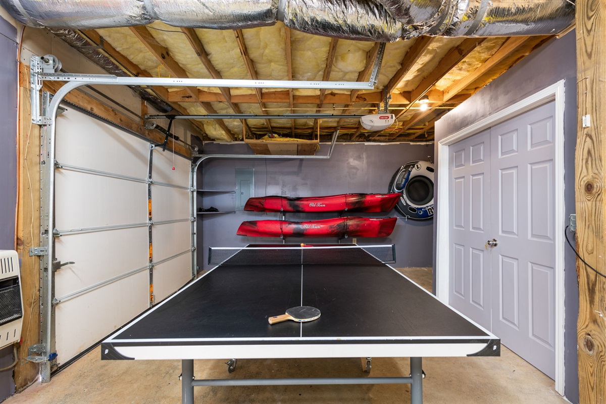 The arrangement of the game and seating creates a fun and comfortable environment for everyone to enjoy.