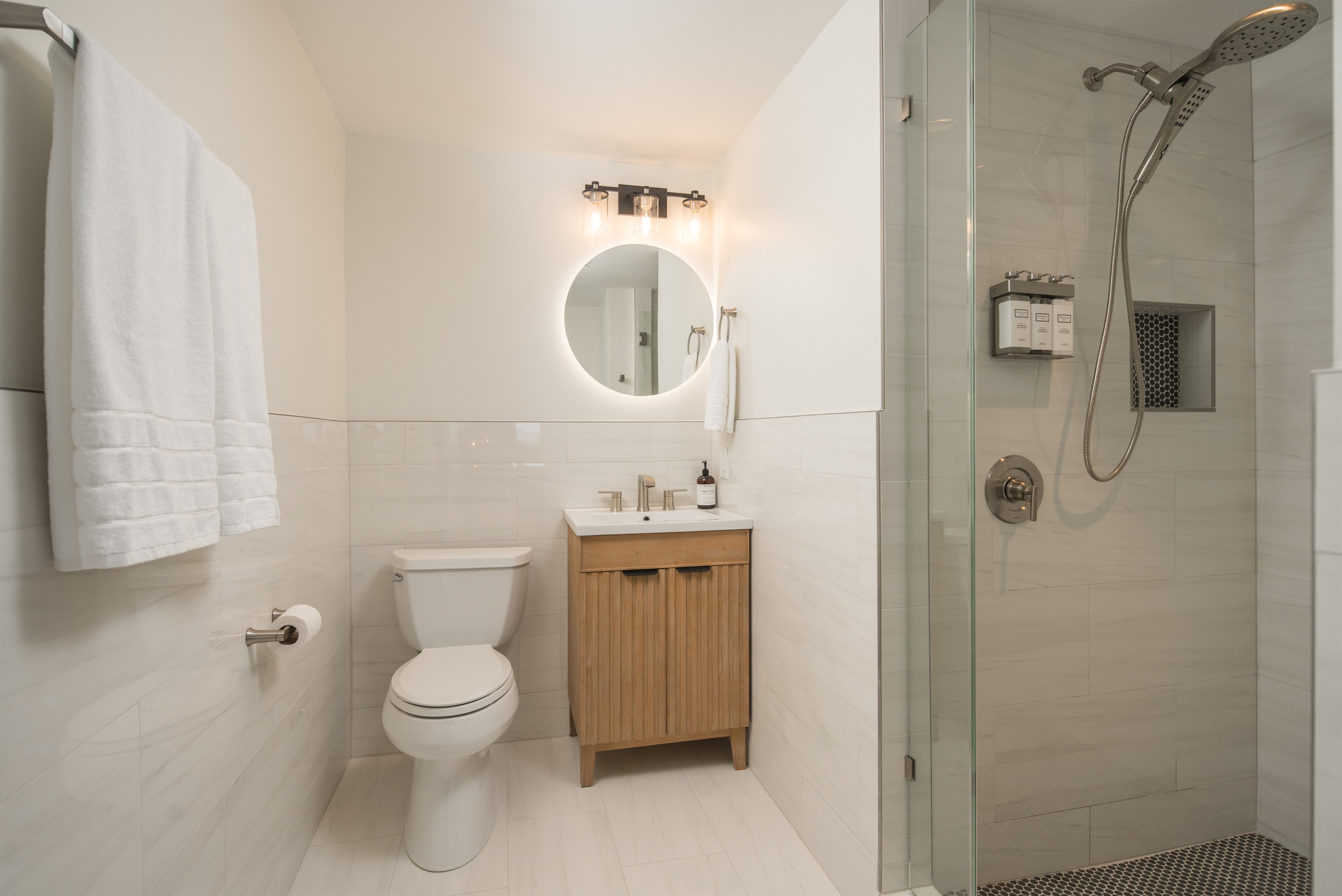 Bathroom #3: Accessed from inside the Fall Leaves Bedroom, the ensuite features heated floors, lighted mirror, hair dryer, and hair and body wash products.
