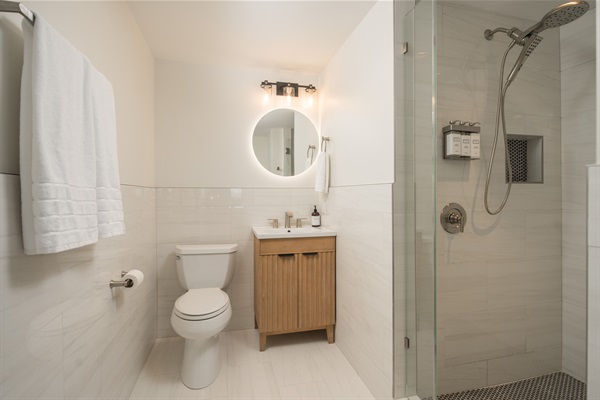 Bathroom #3: Accessed from inside the Fall Leaves Bedroom, the ensuite features heated floors, lighted mirror, hair dryer, and hair and body wash products.