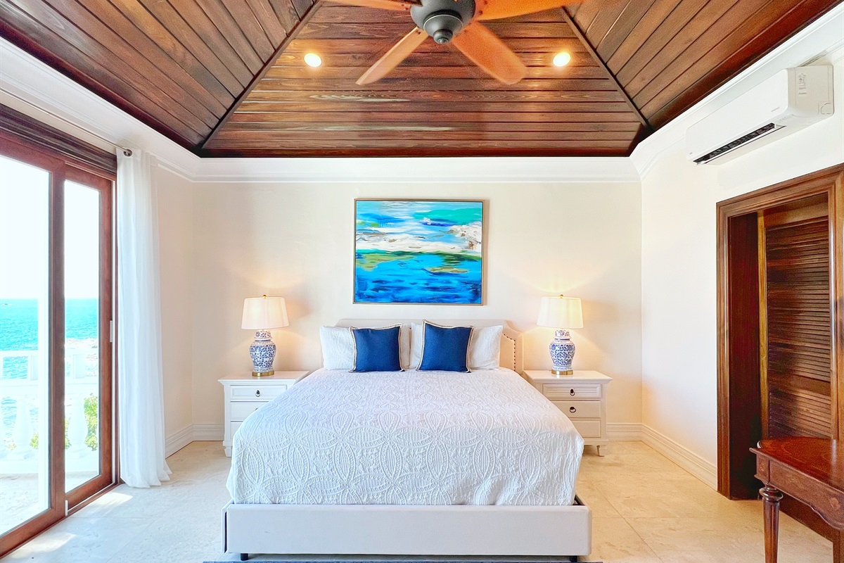 Bedroom's soft tones and luxury linens invite restful nights.