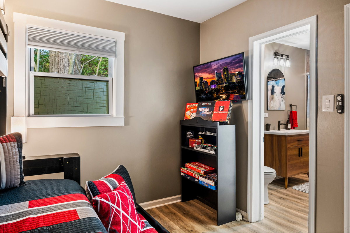 The Wolfpack bedroom celebrates NC State pride with custom artwork and local touches.