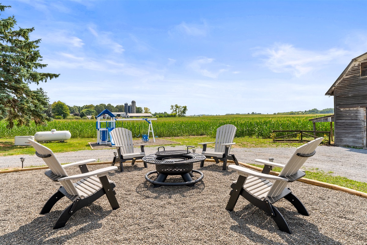 Spacious outdoor fire pit with seating for the whole group, offering perfect nights under the stars.