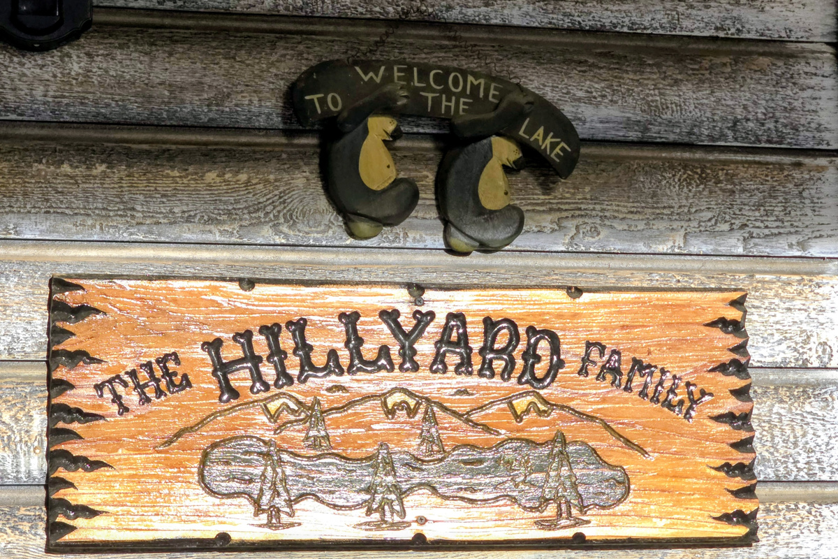 Family sign next to the door entering the kitchen