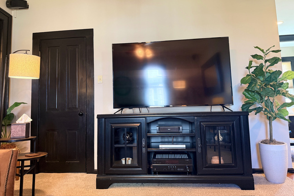 Family room with a 65-inch smart TV and guest streaming profiles ready to use.