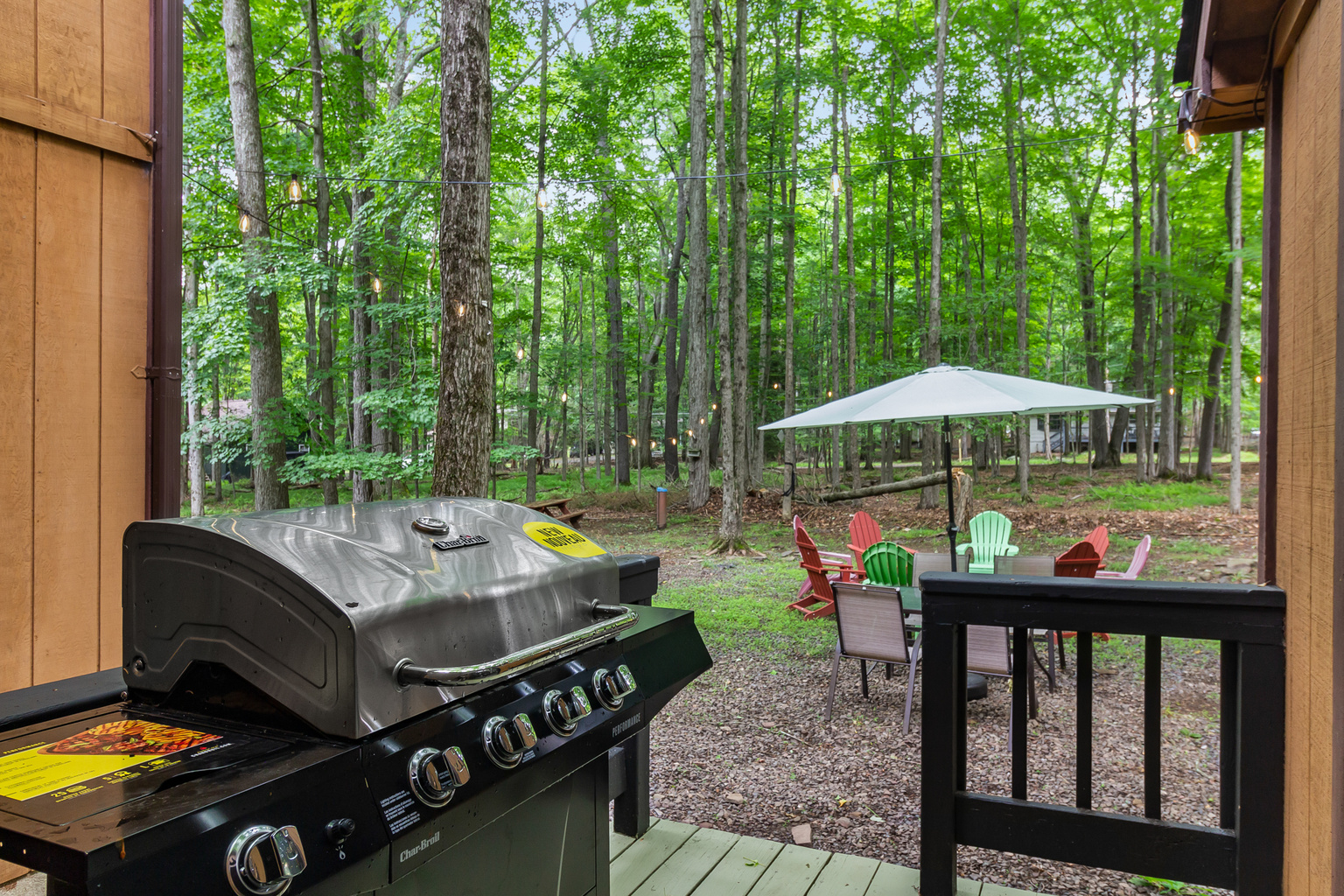 rear porch with BBQ grill. Backyard with firepit