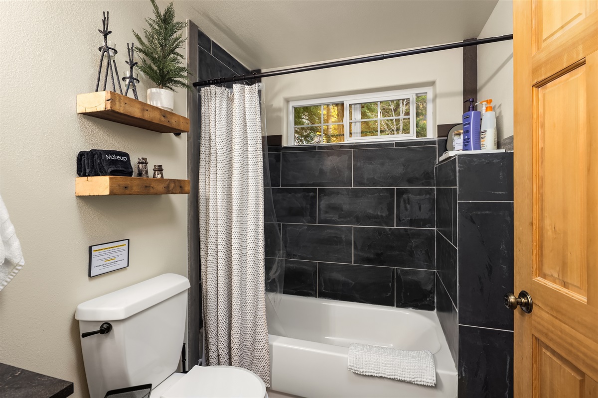 Bathroom #1: main floor with tub/shower combo