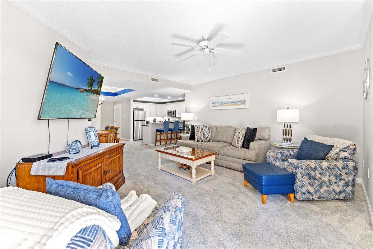 Comfortable Living Room with large TV and balcony access