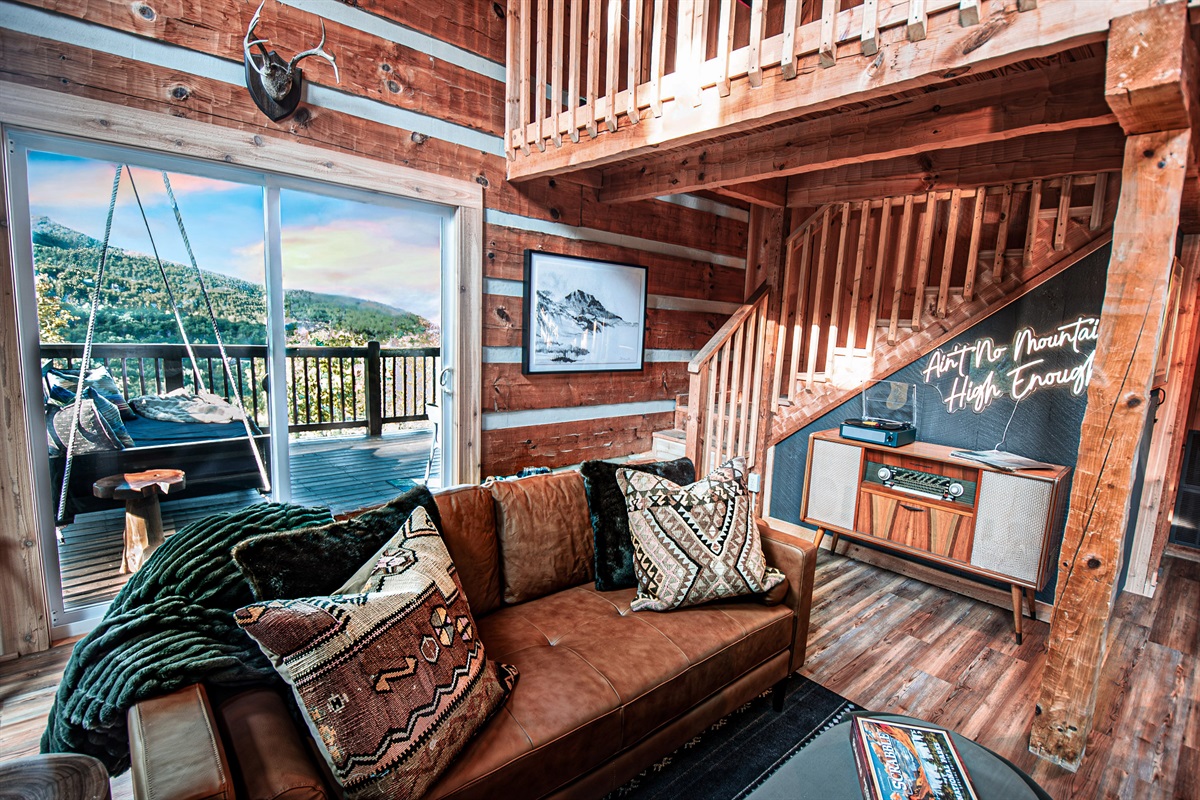 From a cozy memory foam mattress, enjoy expansive views of Bluff Mountain. Velvet blackout curtains optional for those late mornings and extra privacy.