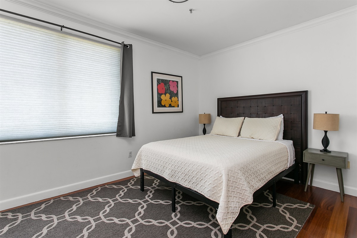 Guest Suite with en-suite bath, closet storage, and room-darkening curtains