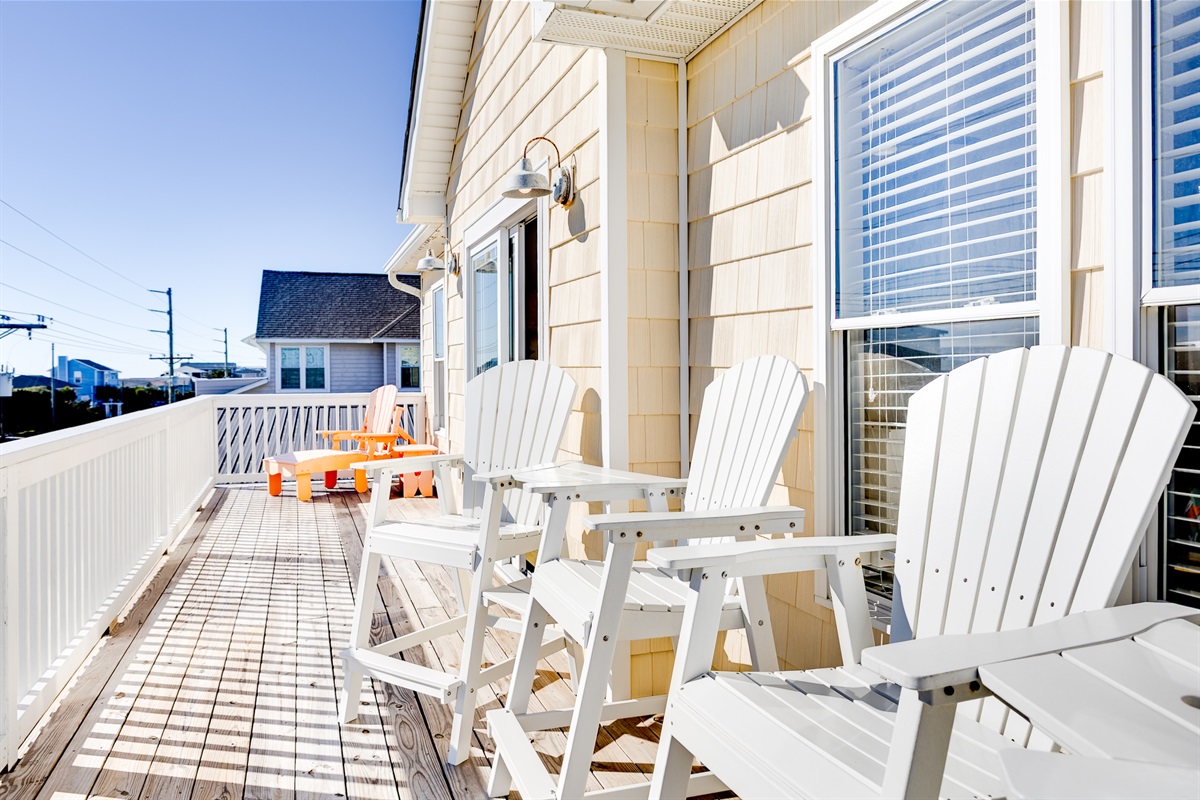 Spacious private deck with Adirondack seating. Soak up the sun, catch the ocean breeze, and unwind outdoors anytime!