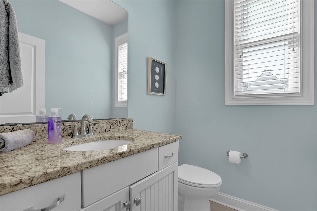 Sparkling clean bathrooms with granite vanities located throughout the home.