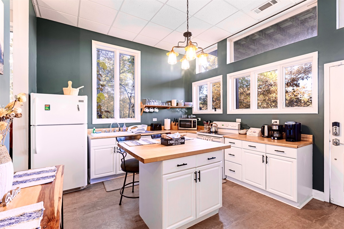 Fully stocked 2nd kitchen with access to lower level balcony.