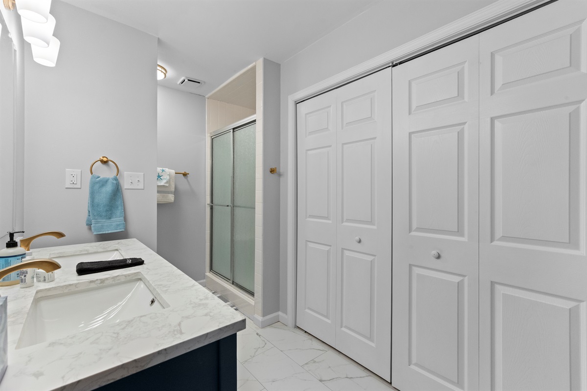 Bathroom: Elegant double sinks and modern shower for your ultimate pampering experience!