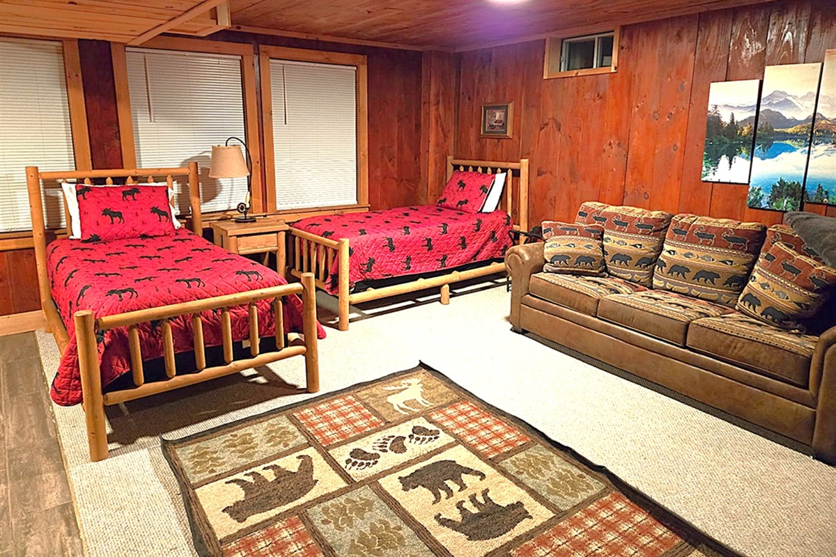 Two twin beds, pull-out sofa bed and a television in the finished basement. Walk out to the hot tub.