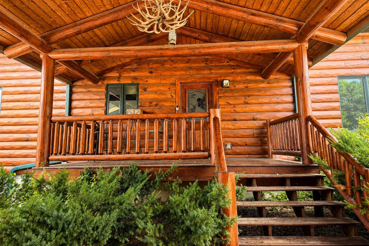 The covered entry porch adds a cozy cabin feel and creates a welcoming transition into the House.
