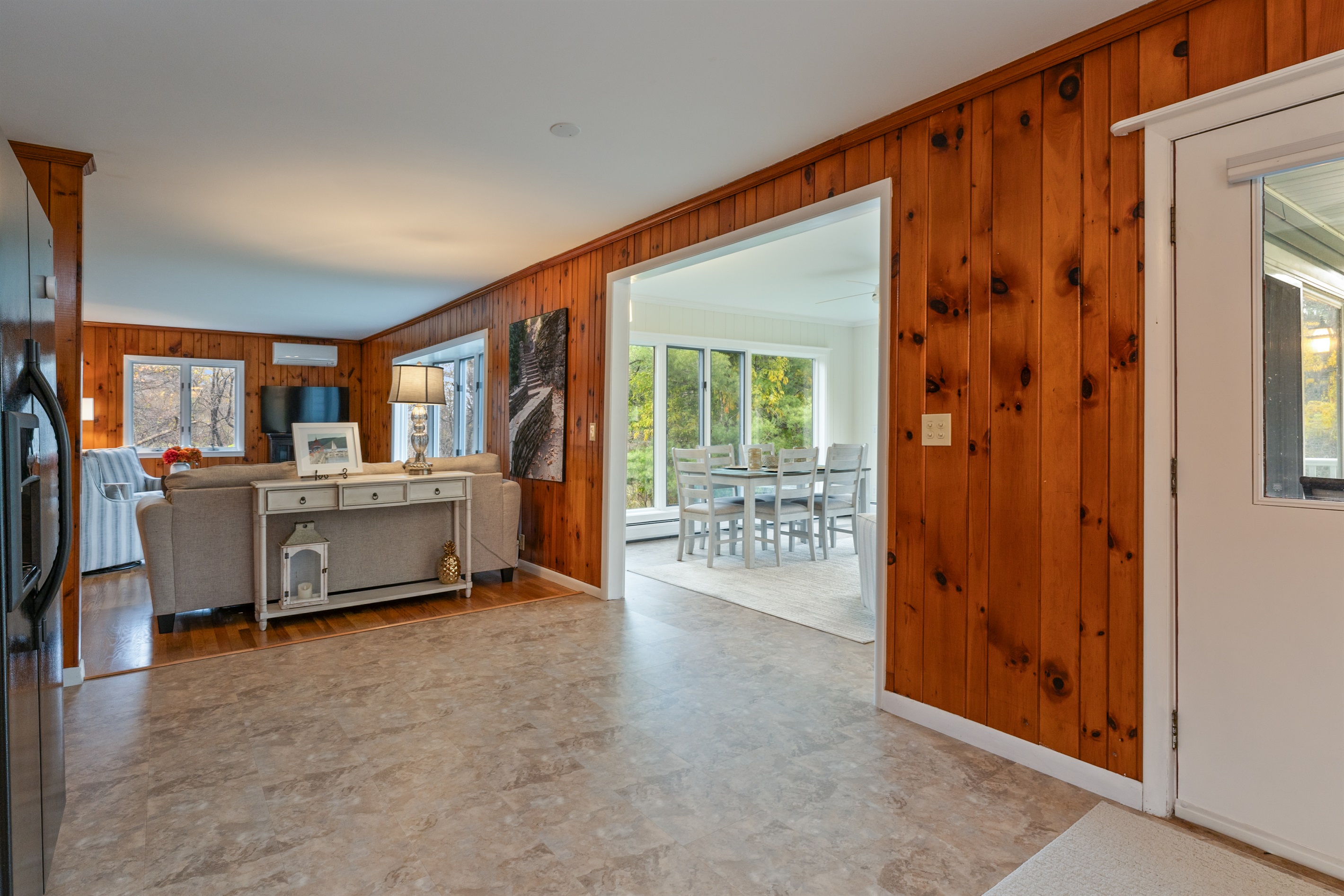 Spacious kitchen extending into the four season room