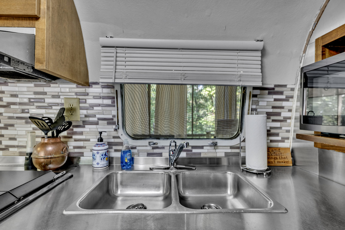 Full kitchen sink and prep space make this little Airstream surprisingly practical