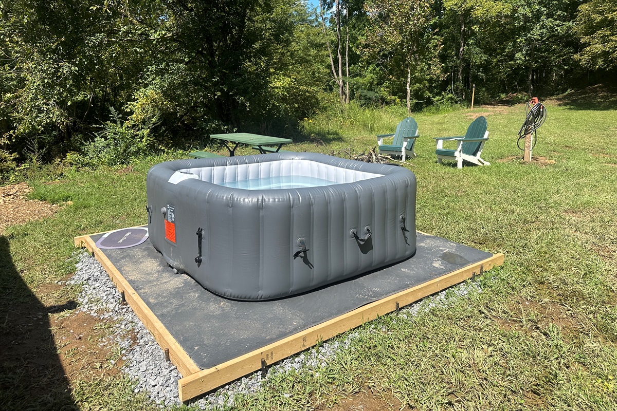 Your private oasis awaits! Relax in the inviting hot tub while enjoying the sounds of nature and the fresh air.