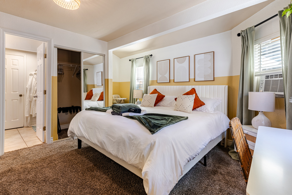 Retreat to your stylish sanctuary with plush bedding and vibrant decor!