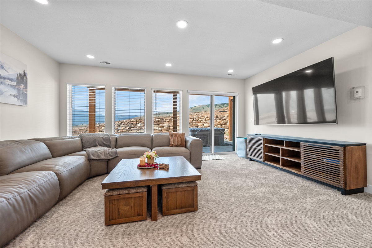 The family room has sectional seating and a large smart TV.