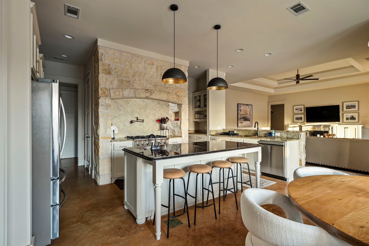 A fully equipped kitchenette includes a fridge, stove, oven, microwave, sink, and utensils for convenient cooking.