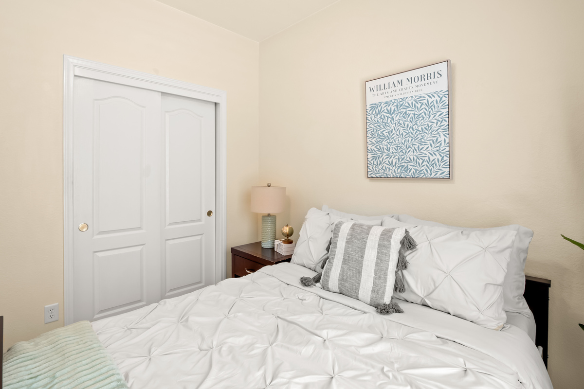 This inviting bedroom is designed for comfort and relaxation, it's a welcoming retreat after a busy day.