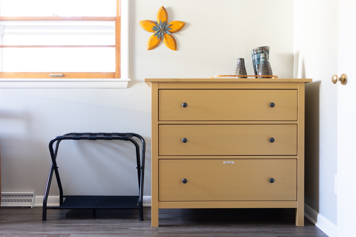 Dresser, luggage rack and full size closet for all your storage needs