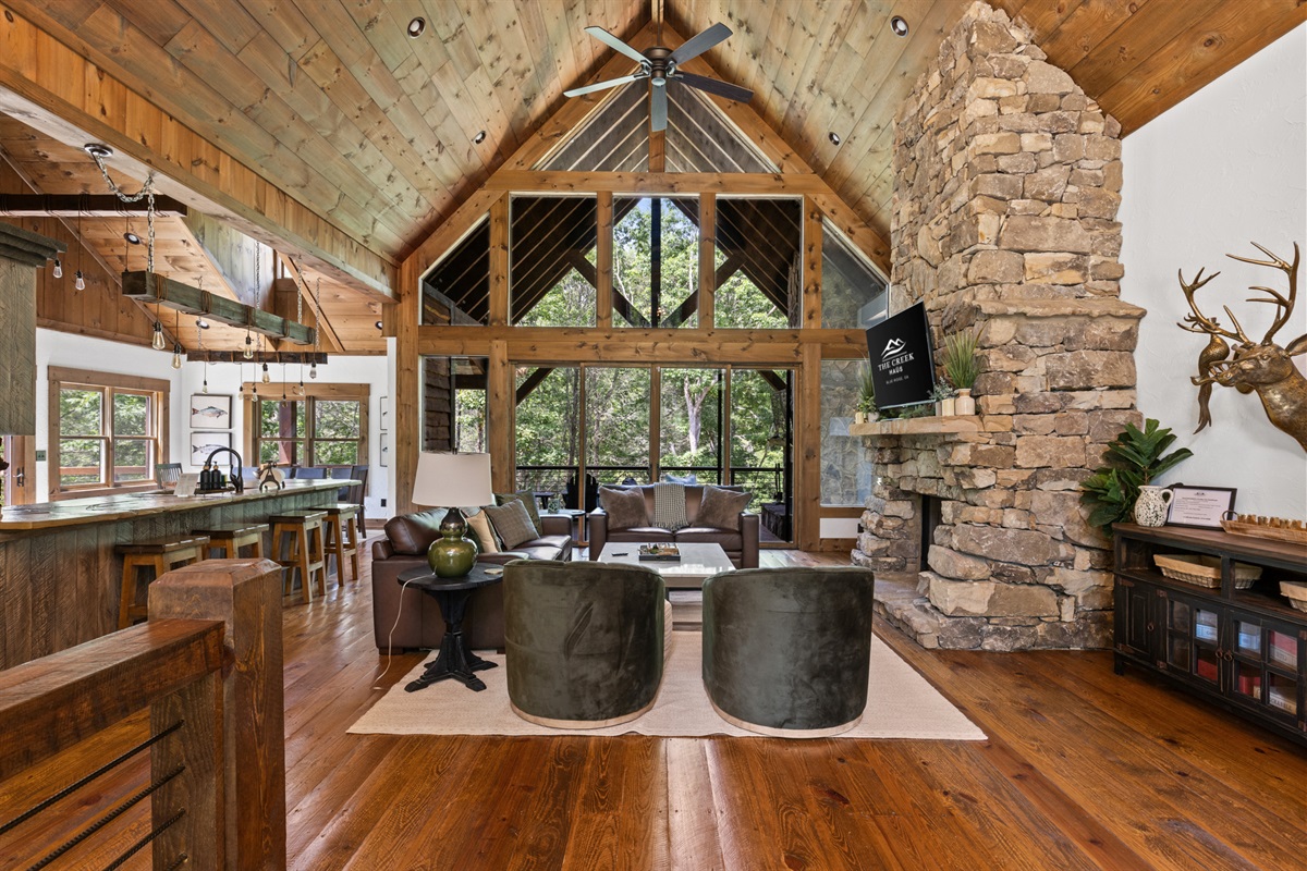 The soaring ceilings, large windows, and rustic touches create a bright and welcoming space for relaxation and connection.