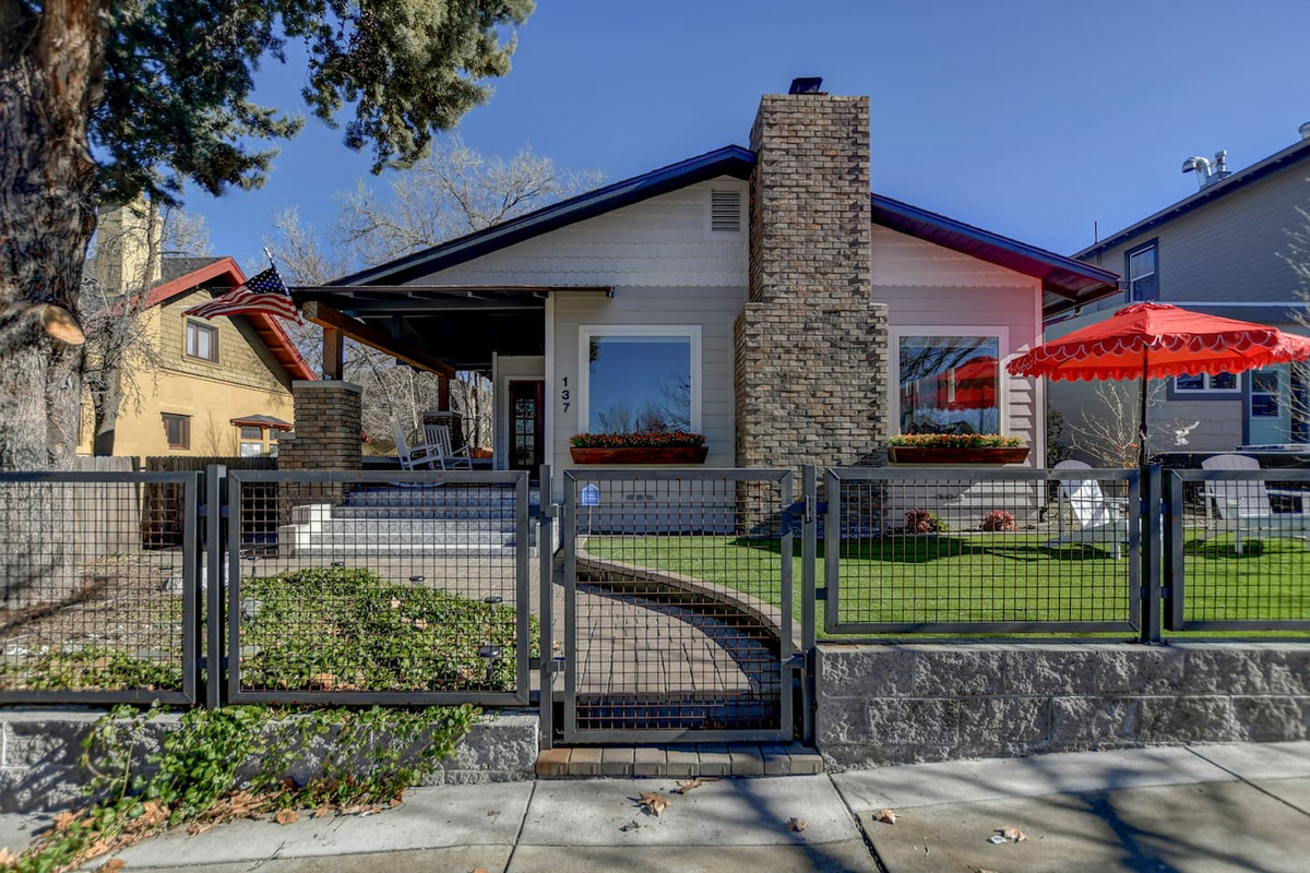 A classic craftsman facade with a welcoming front porch sets the tone for your stay.