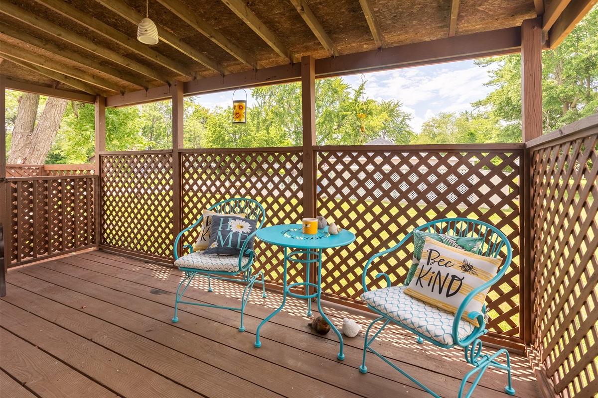 Your peaceful retreat. Sip, sit, and soak in the fresh air on the covered deck’s bistro set and metal bench.