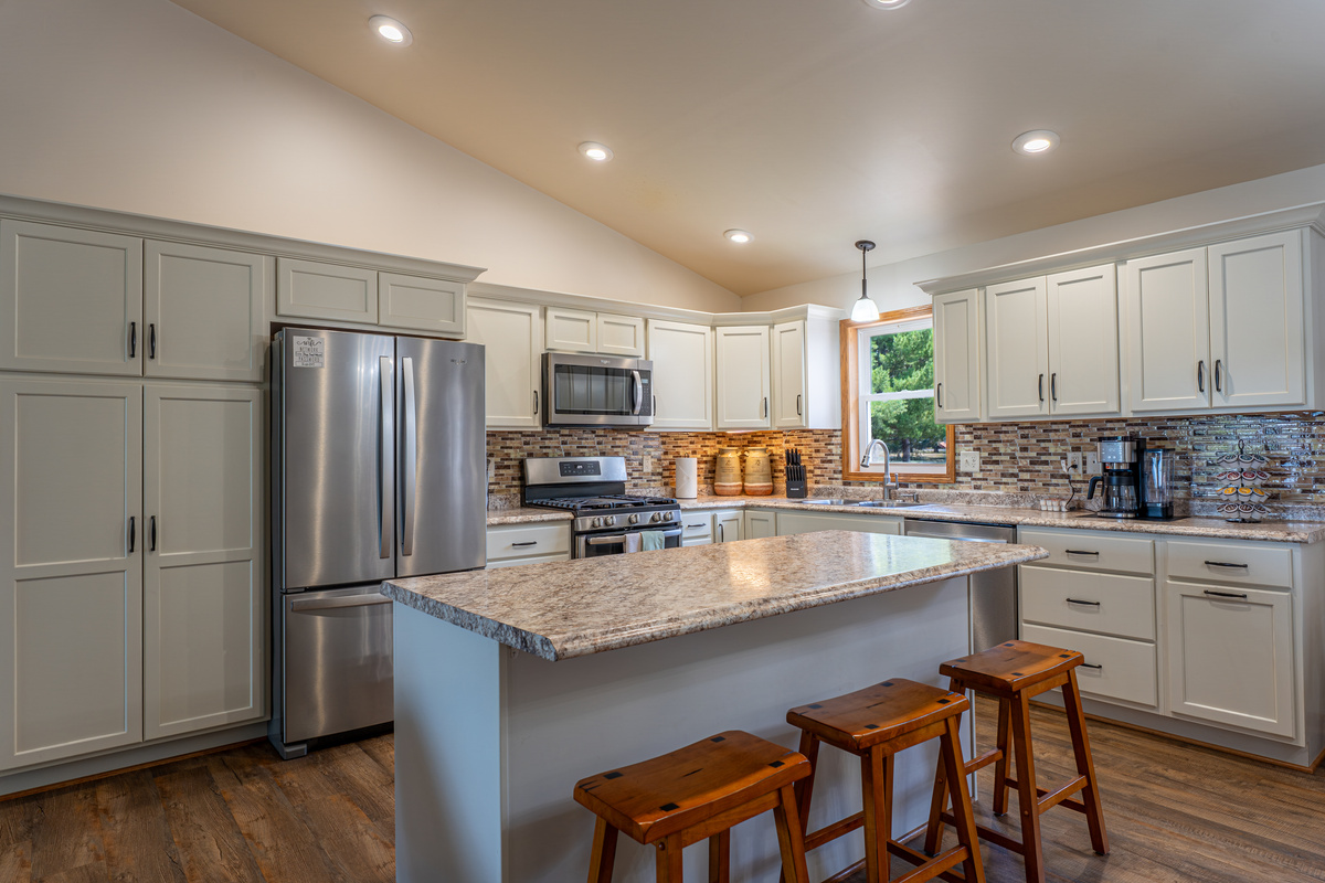 Fully stocked kitchen with a center island, full-size appliances, and enough space for the whole crew to cook together. Everything you need, nothing you don't