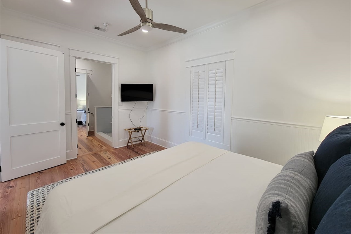 Master bedroom looking into shared bathroom.