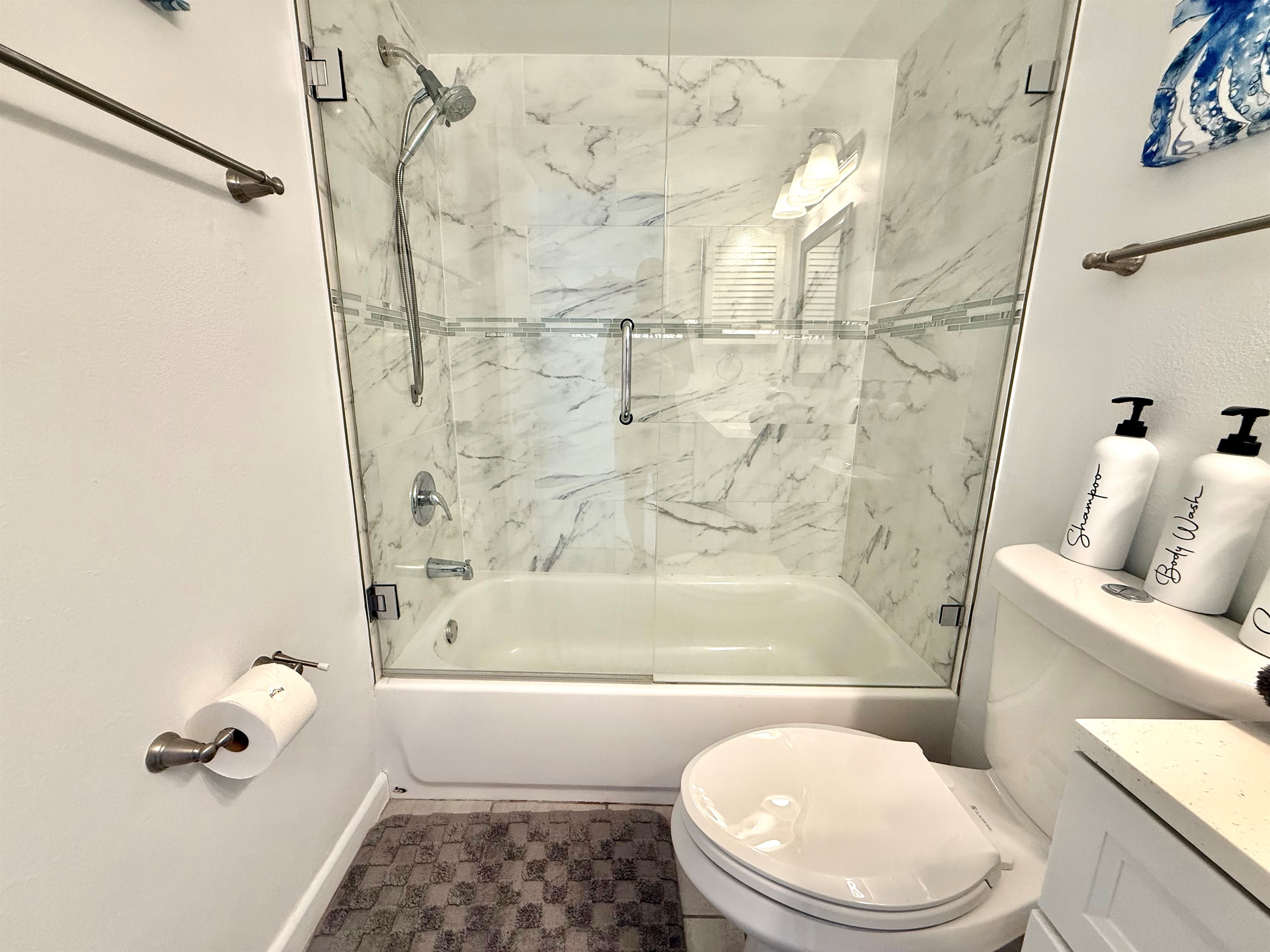 Perfect for soaking or a quick shower — this bathroom combines style with functionality.