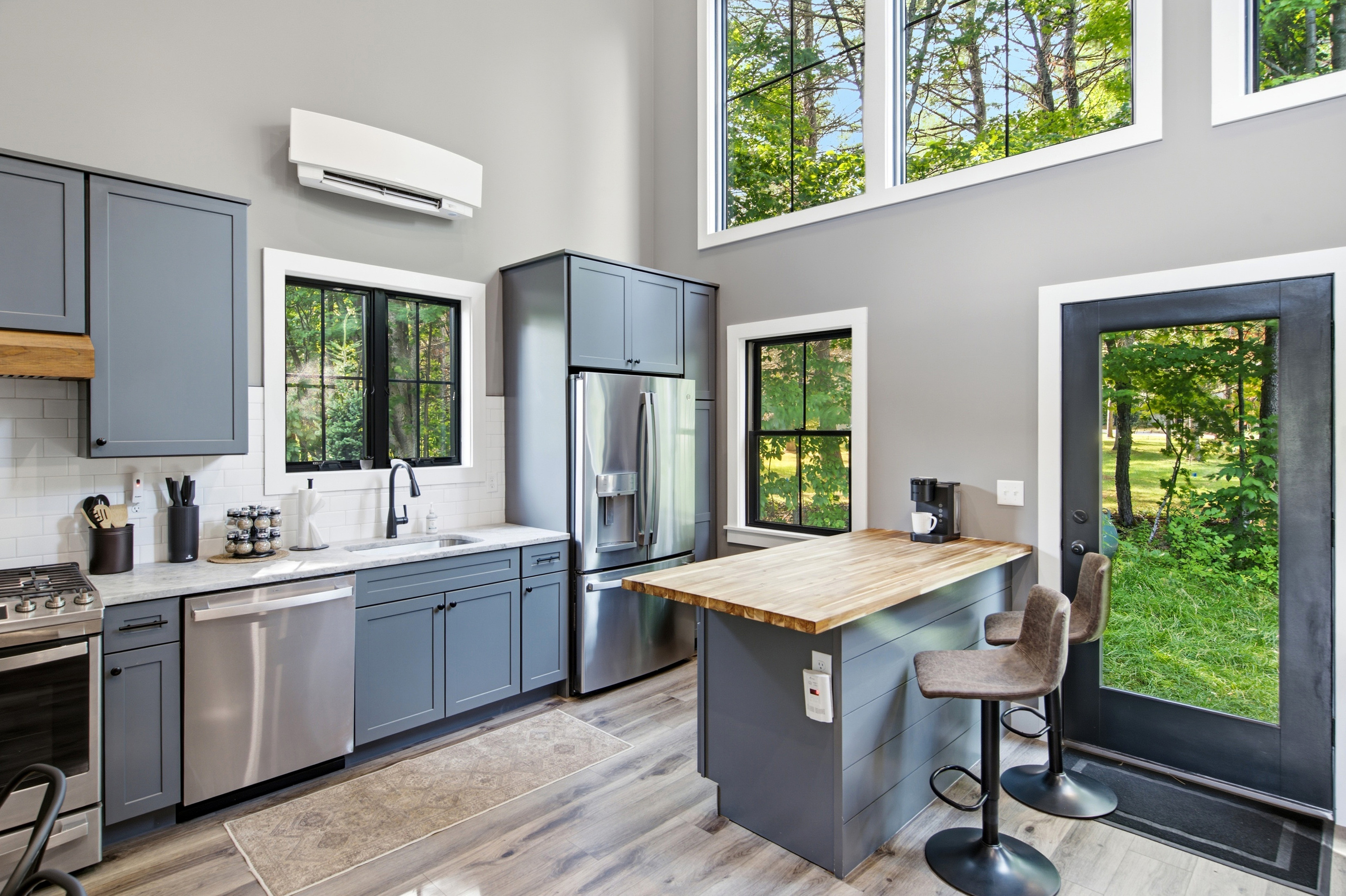 A modern kitchen with generous workspace makes preparing meals simple and convenient.