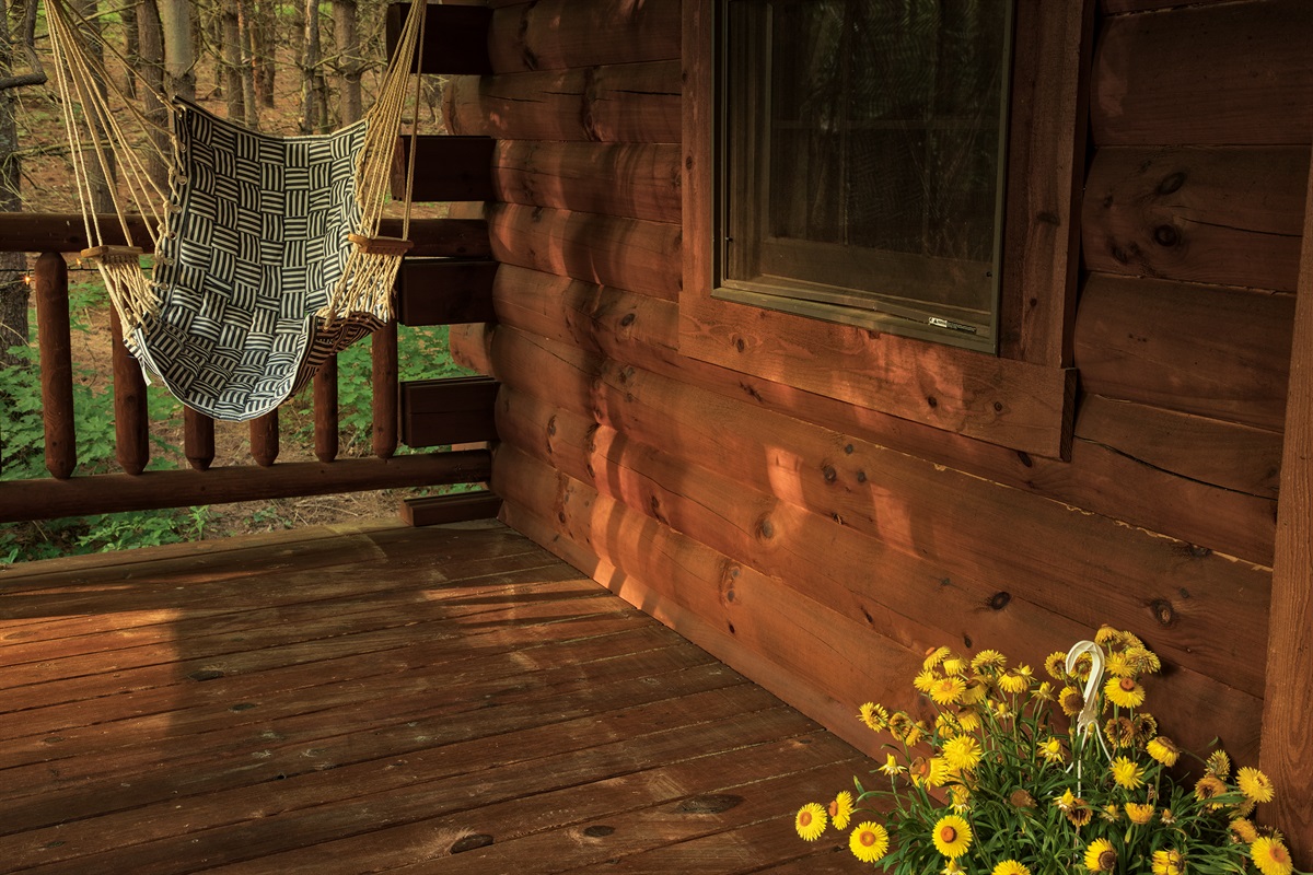 Enjoy the sounds of nature while sitting outside on the front porch.