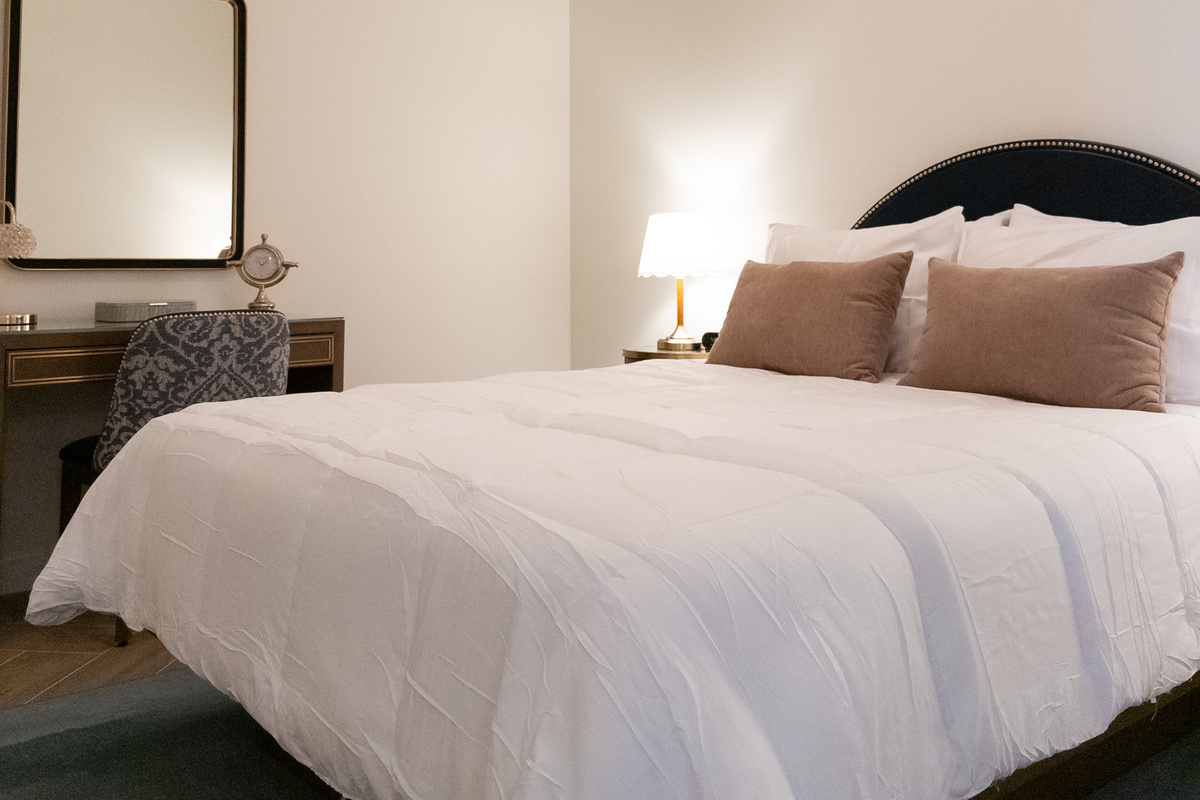 Sink into the Queen-size bed dressed in layered, hotel-quality linens.