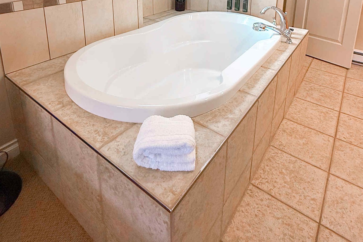 Unit A Soaker tub right in primary suite.