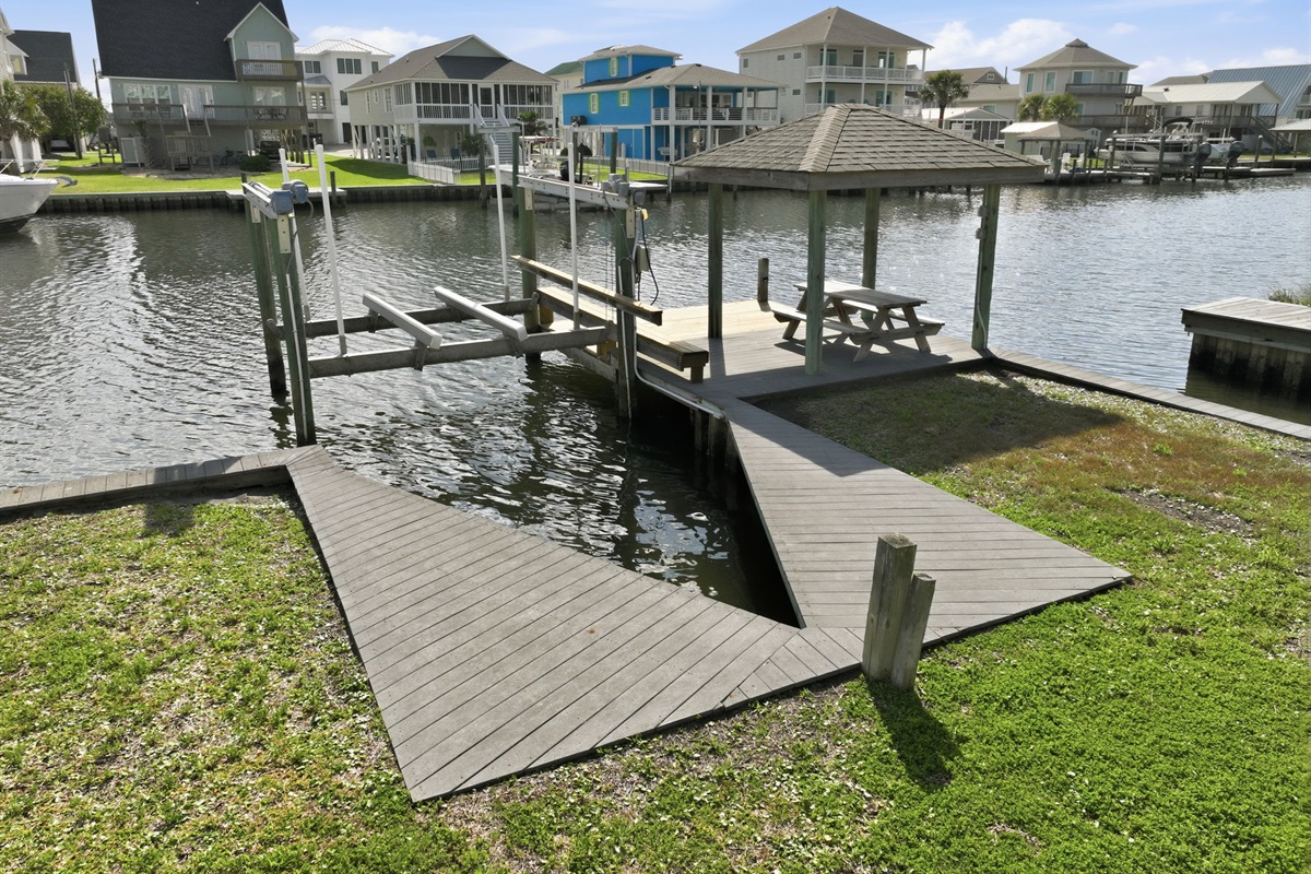 Private dock with covered gazebo and boat lift right on the canal