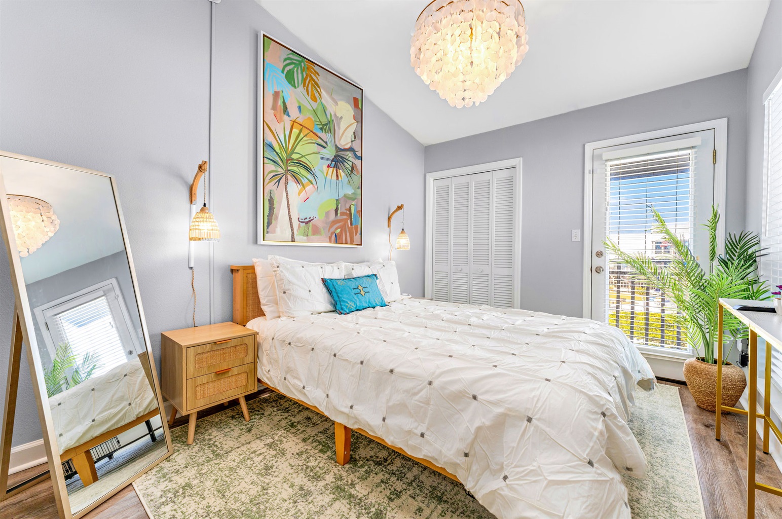 The guest bedroom features a smart TV and a comfortable Queen Zinus bed and is conveniently located next to a full bathroom.