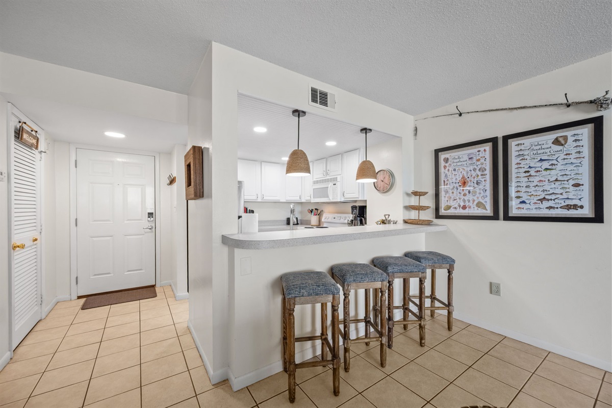 Breakfast bar with seating for four, perfect for casual meals and morning coffee